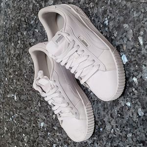All white Puma Cali Sneakers